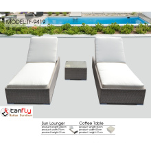 Patio wicker lounge chair for swimming pool.